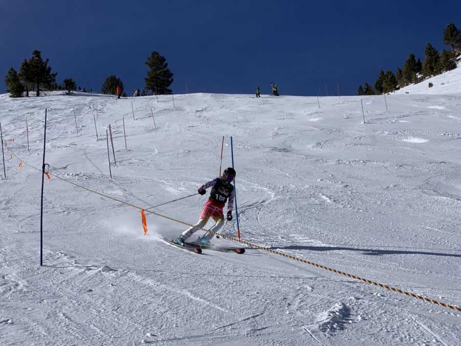 A racer skis down the slope during a race in February. The team has been working on their skills while still having fun.